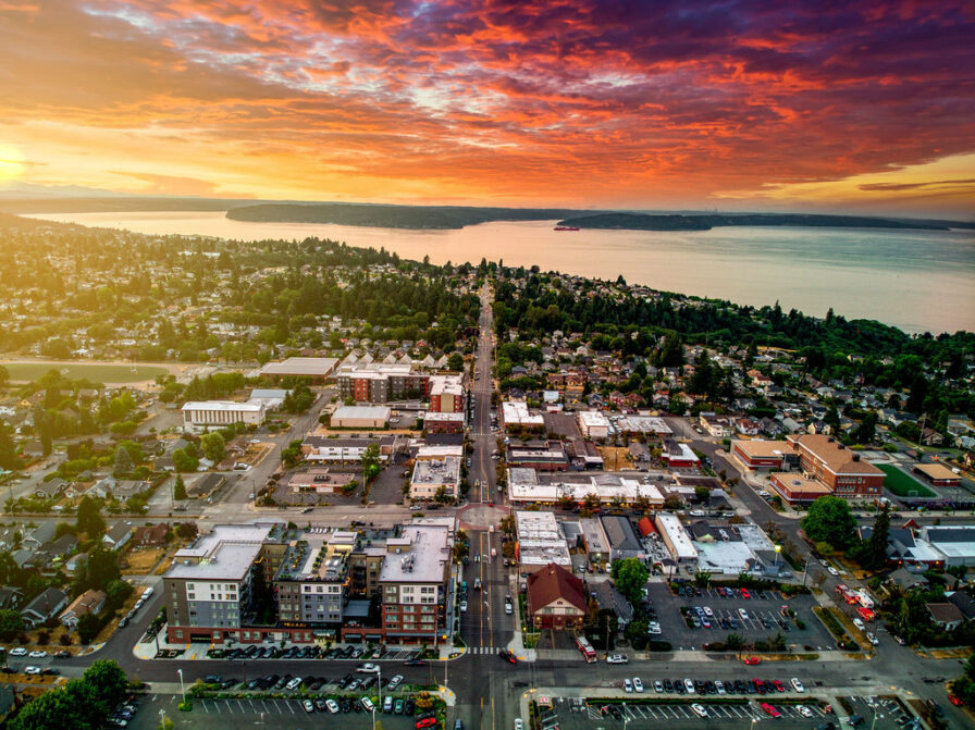 Aerial view of the Proctor District in Tacoma at sunset with a dramatic sky
