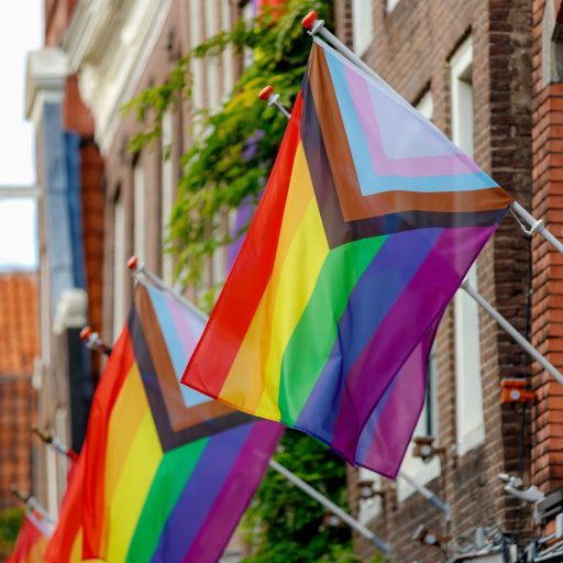 Progress pride flag (new design of rainbow flag) waving in the a